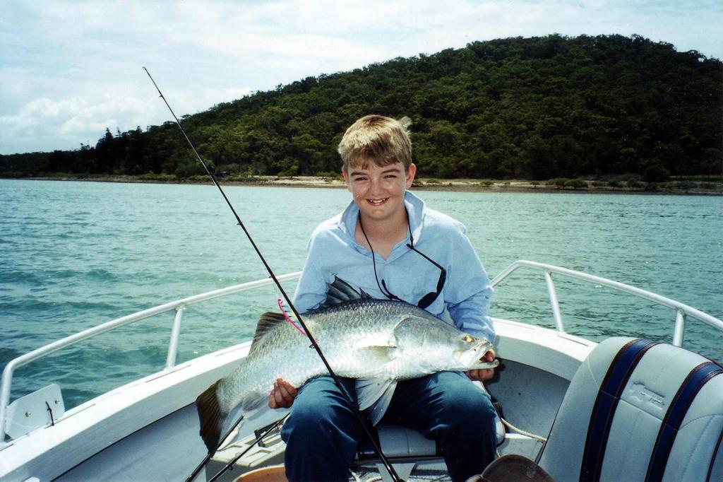 A very young author with a nice barra trolled from a deep hole near the islands.   © Lee Brake